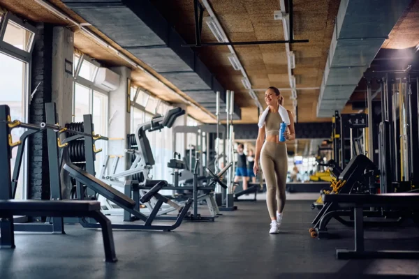 full-length-of-happy-athletic-woman-walking-throug-2026-01-09-11-38-17-utc